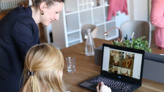 girl using black laptop computer