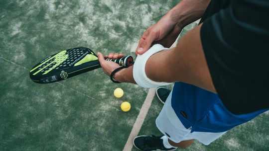 person holding tennis racket